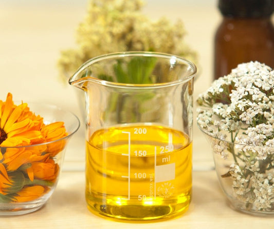 organic hair oil in a small glass bottle