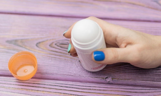person holding natural deodorant stick illustrating why natural deodorants really work