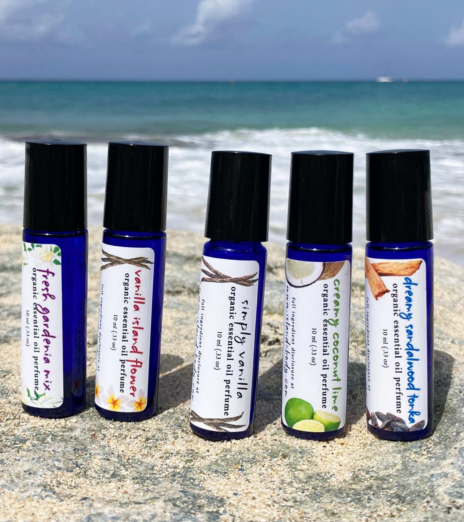Natural essential oil perfume oils in blue glass roll-on bottles – organic non-toxic perfume collection by Island Deodorant.