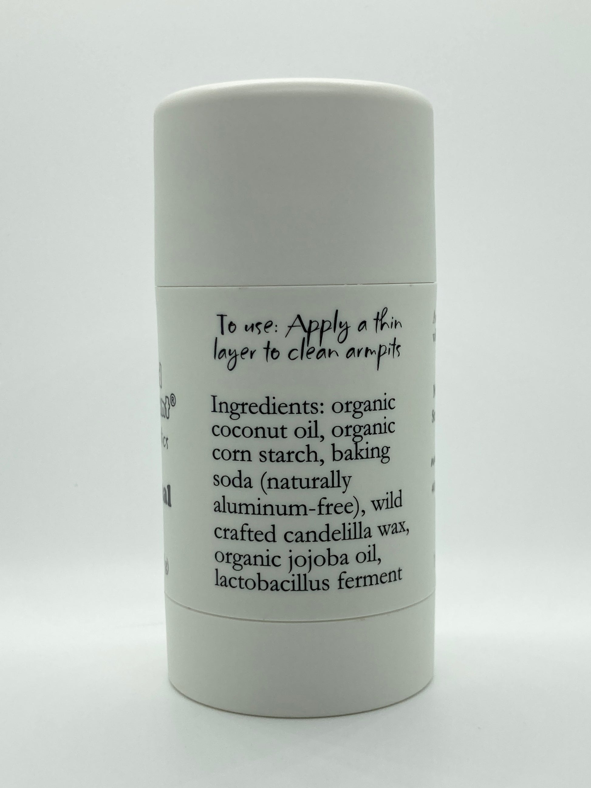 Close-up view of Island Deodorant Original formula ingredients including organic coconut oil, baking soda, candelilla wax, jojoba oil, and probiotics
