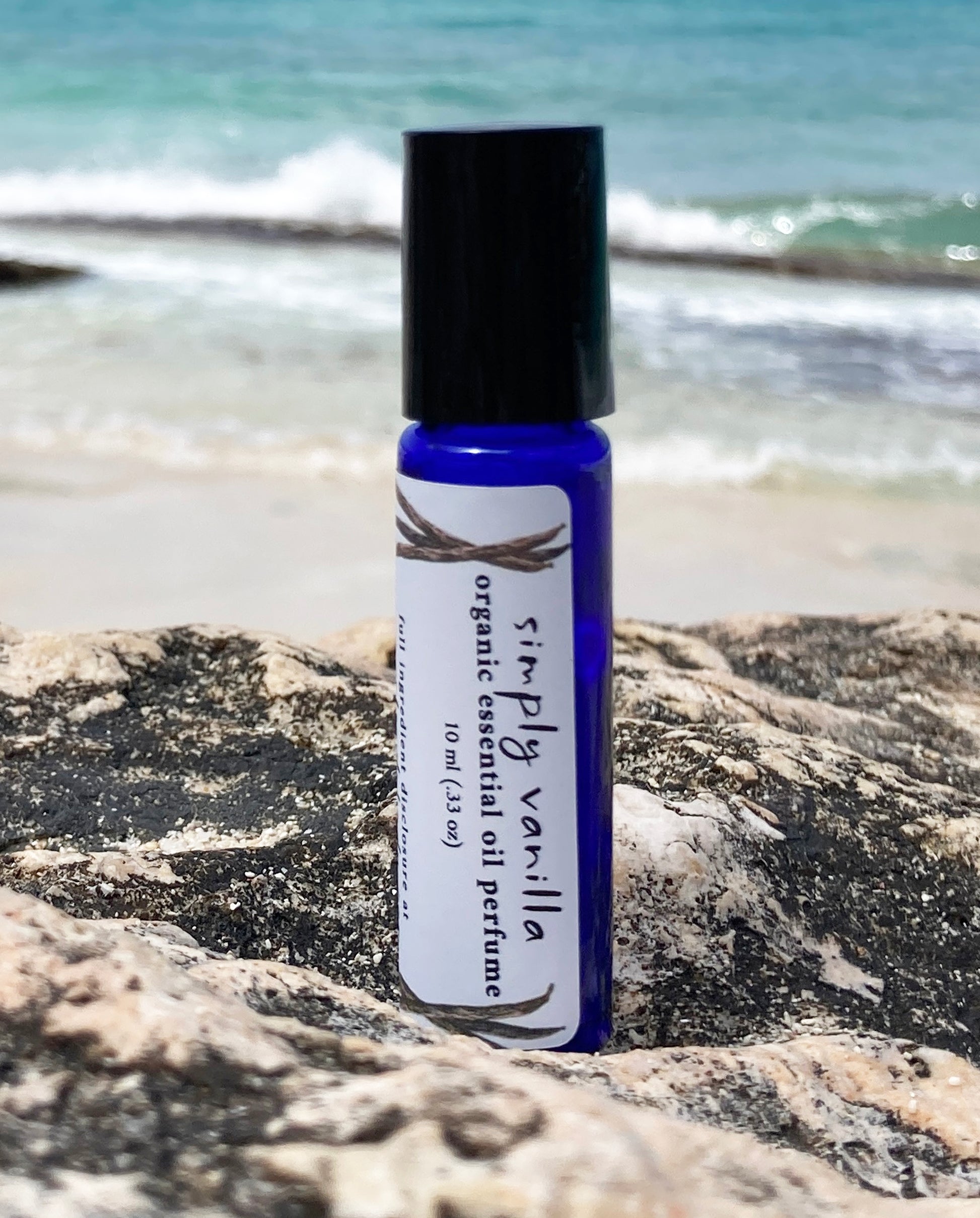 Natural vanilla essential oil perfume roll-on in blue glass bottle – organic vanilla perfume oil by Island Deodorant.