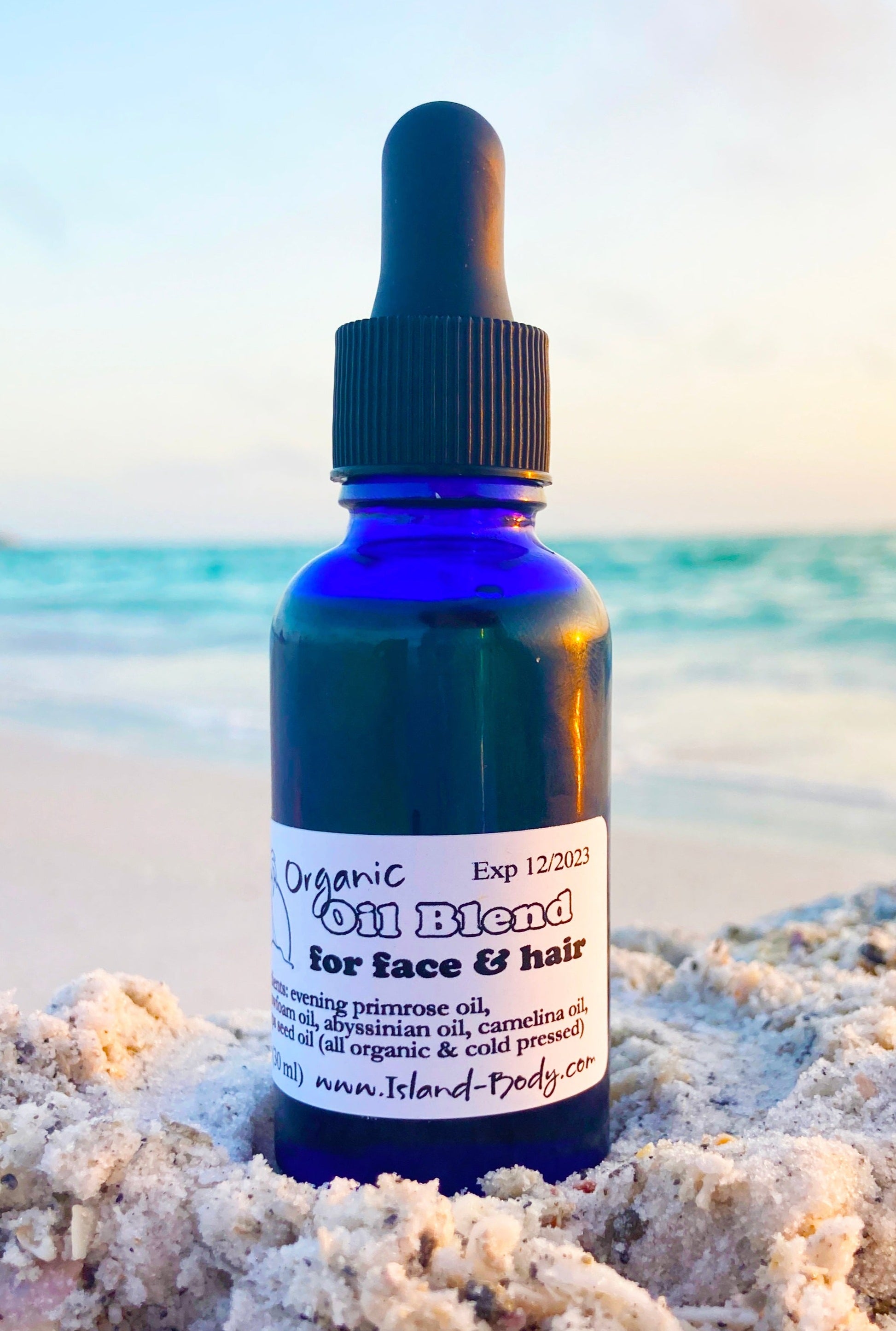 organic hair oil dry oil for hair and scalp in blue glass dropper bottle