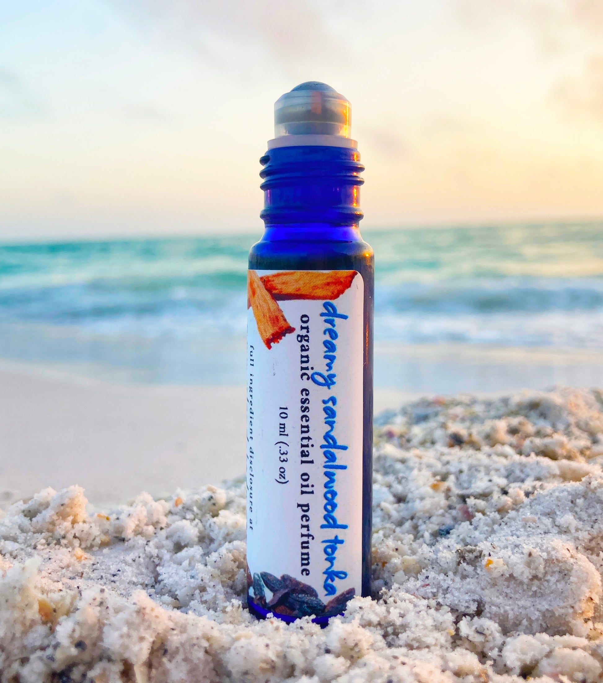 Sandalwood tonka perfume oil roll-on made with organic essential oils – natural long-lasting masculine fragrance by Island Deodorant.