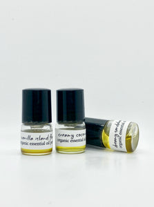 picture of  three 1 ml clear glass bottles containing 3 different scents of Essential Oil Perfumes