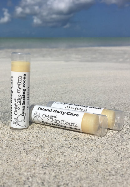 Organic cocoa butter lip balm on beach, natural fragrance-free lip balm made with cocoa butter and plant oils