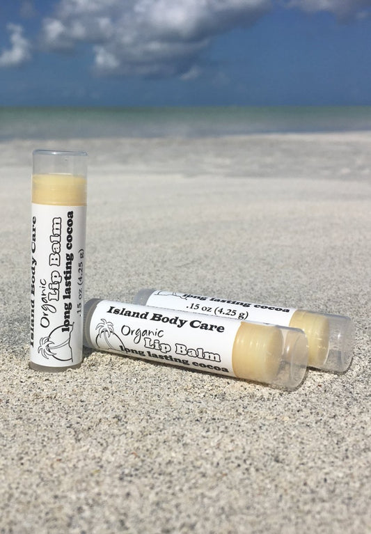 Organic cocoa butter lip balm on beach, natural fragrance-free lip balm made with cocoa butter and plant oils