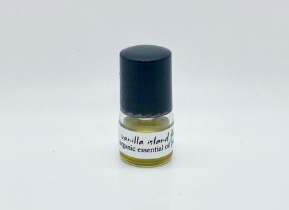 1ml sample bottle of Vanilla Island Flower essential oil perfume with black cap and white label — natural tropical vanilla perfume by Island Deodorant.